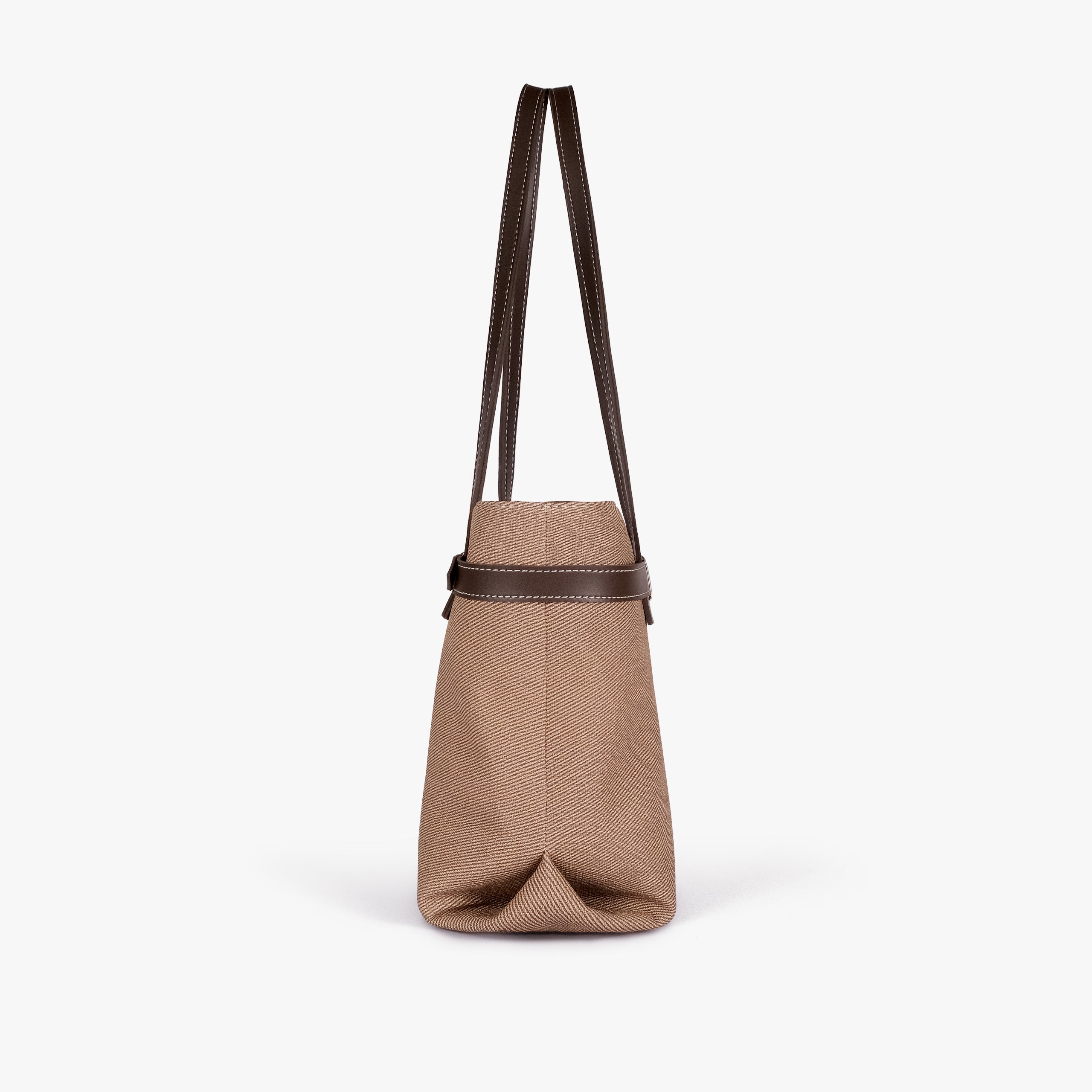 Dark brown belted tote bag — side profile showing the slim depth, folded side gusset, smooth trim edge, and long shoulder handle drop, taupe-brown textured body with dark brown smooth faux-leather trim