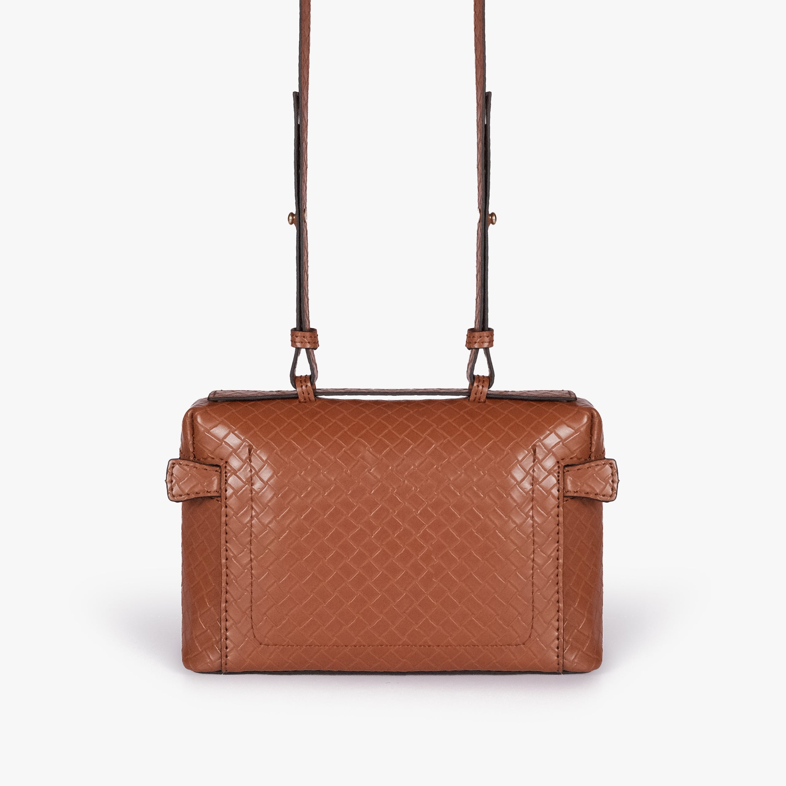 Terracotta weave vanity top-handle bag — back view showing the plain quilted back panel, top handle, long strap, flat base line, and no visible exterior pocket