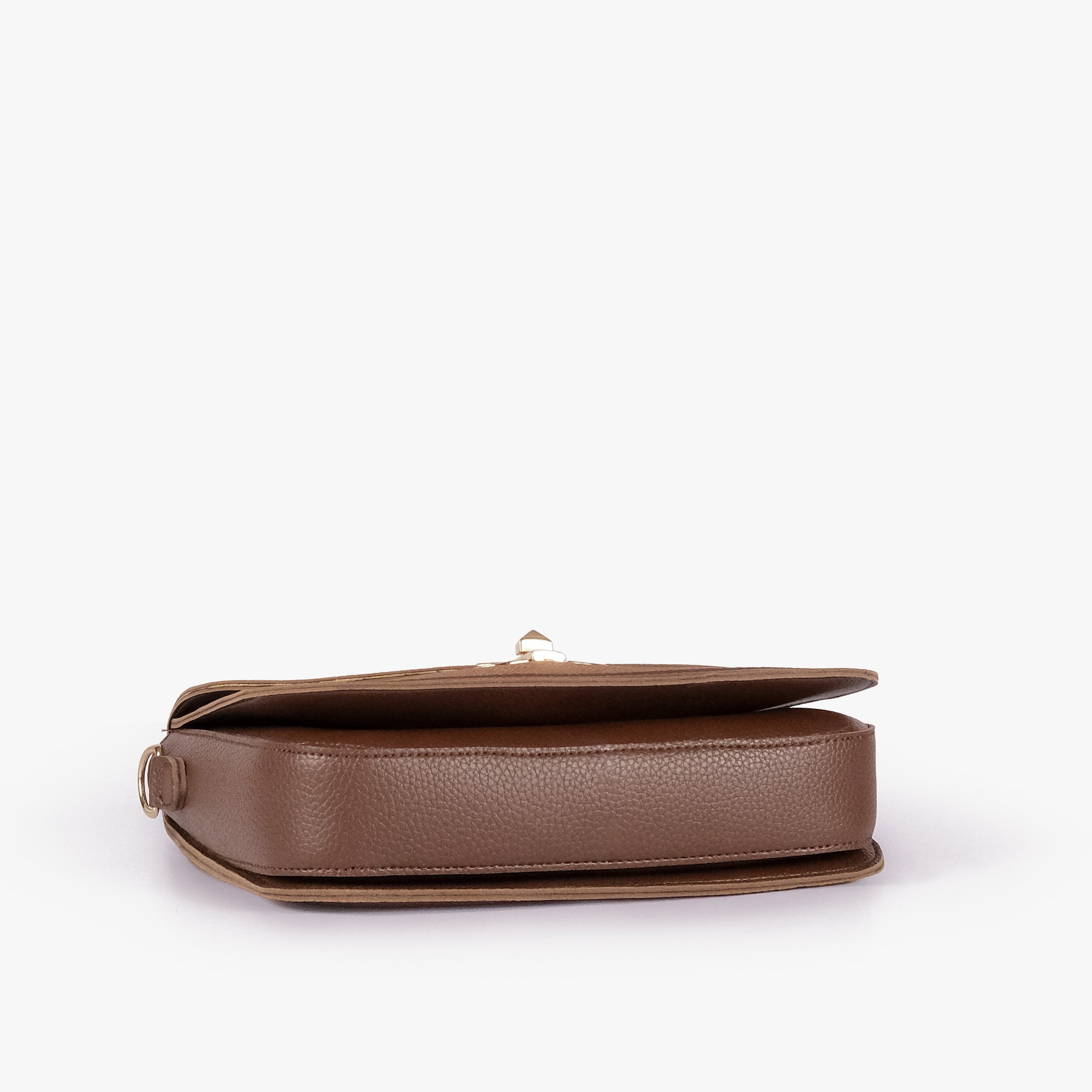 Tan contrast cross-body bag — tilted underside flat lay showing flap edge and bag depth