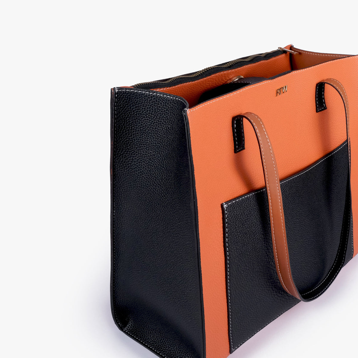 Close-up of Ember color blocking tote showing the color-block panels and handles