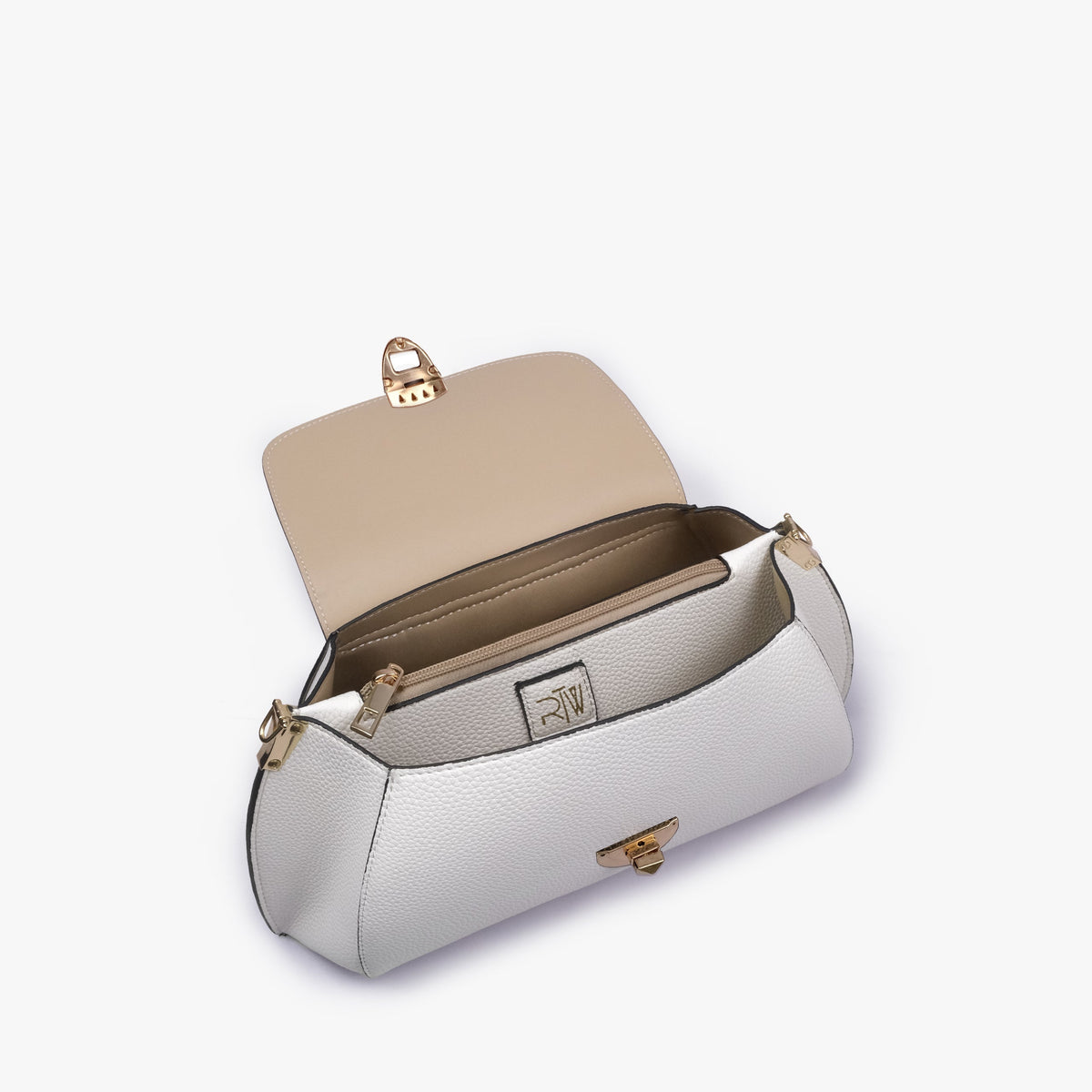 Interior of Ivory pebble baguette bag with the flap open showing the zippered main compartment