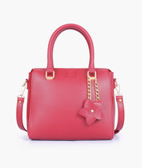 Maroon handbag with flower charm