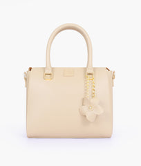 Off-white handbag with flower charm