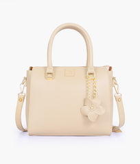 Off-white handbag with flower charm