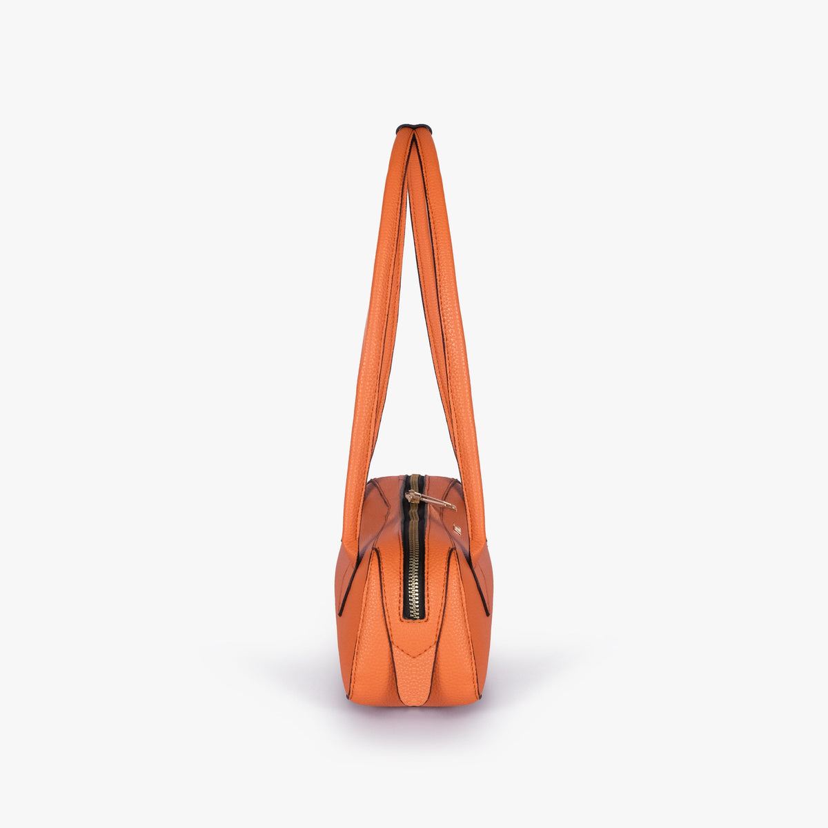 Side profile of orange east-west baguette bag