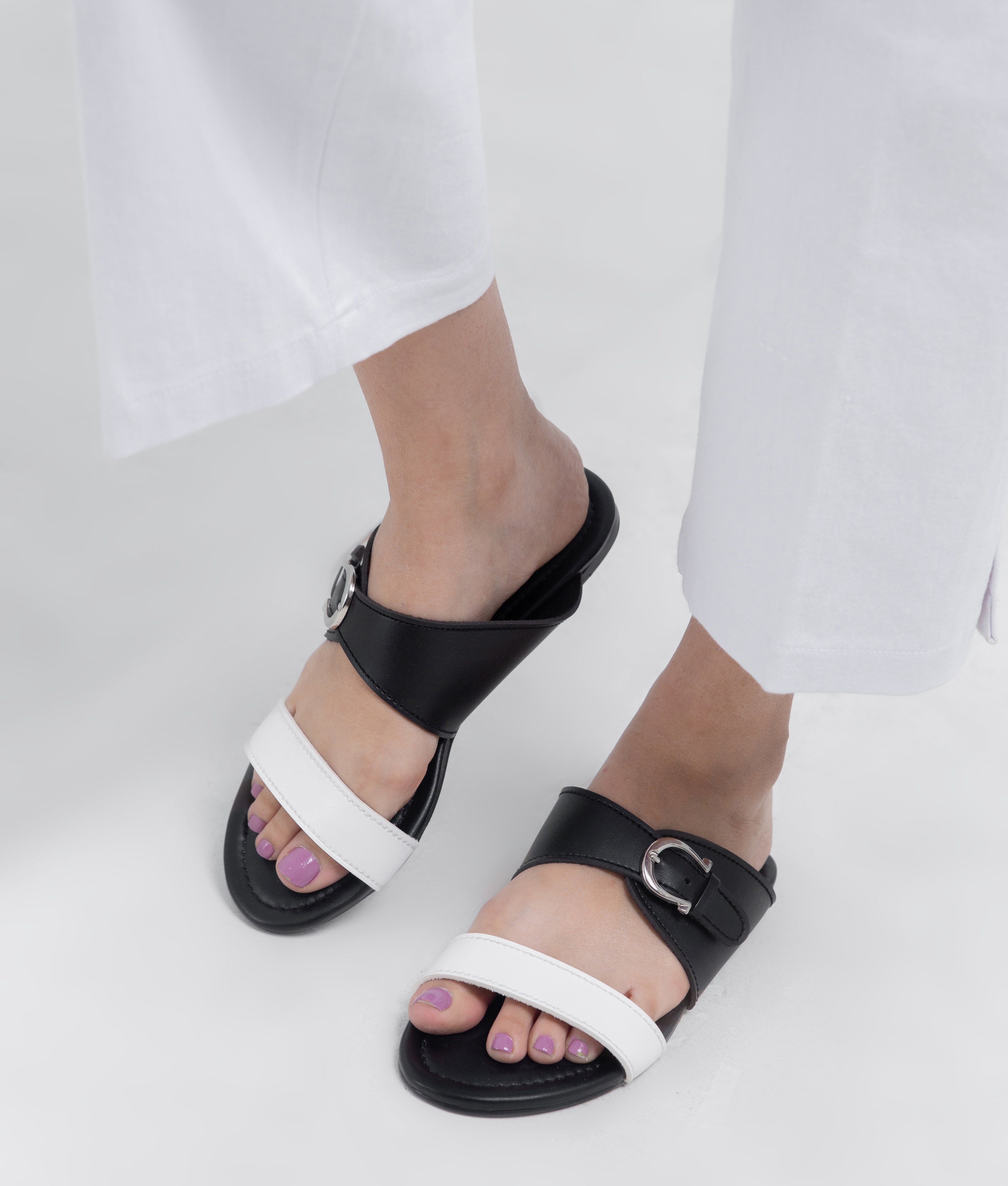 White and black buckle-up flats